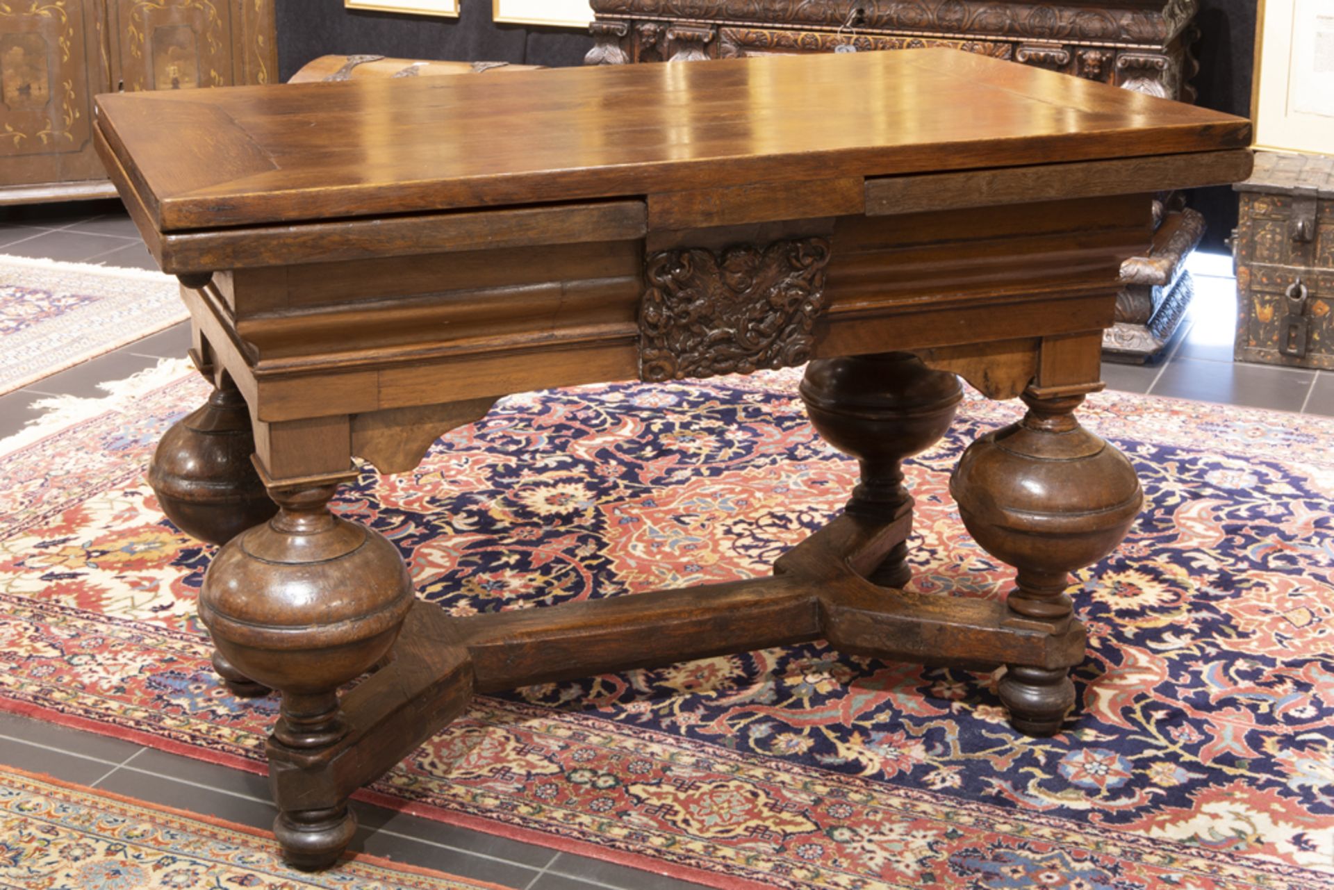 very good 17th Cent. Low Countries oak table with typical feet and with on both sides a walnut bas-