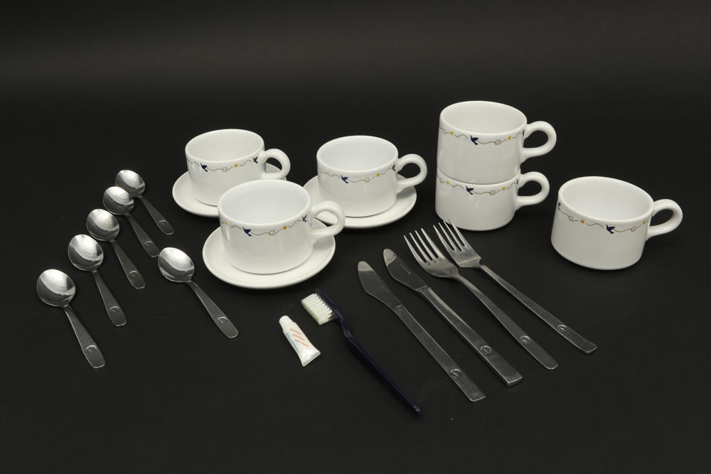 several Sabena memorabilia amongst which cutlery and cups with a decor based on René Magritte ||