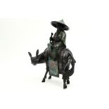 Chinese "Man sitting on a donkey" sculpture in bronze and cloisonné