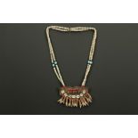 North Indian Naga necklace with beads and a wooden pendant with teeth and bronze heads