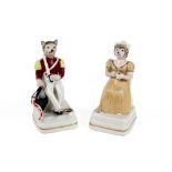 pair of German porcelain Art Deco inkwells each with a figure with a cat's head