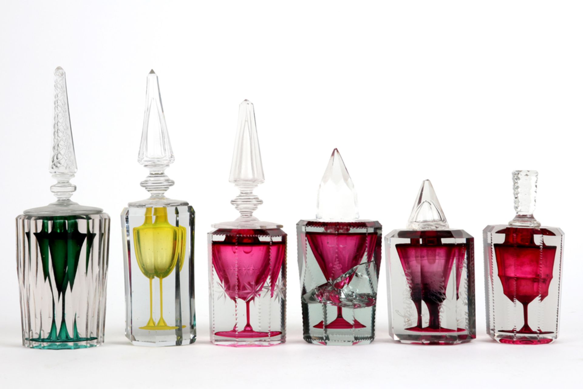 six 19th and 20th Cent. ink bottles in (crystal)glass with inlaid color