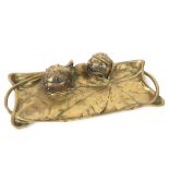 Art Nouveau inkstand in brass with vegetal ornamentation with two chestnuts
