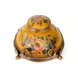 antique inkwell in painted metal with a flowers decor and with a gilded metal mounting