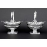 pair of 'antique' biscuit baskets in marked silver