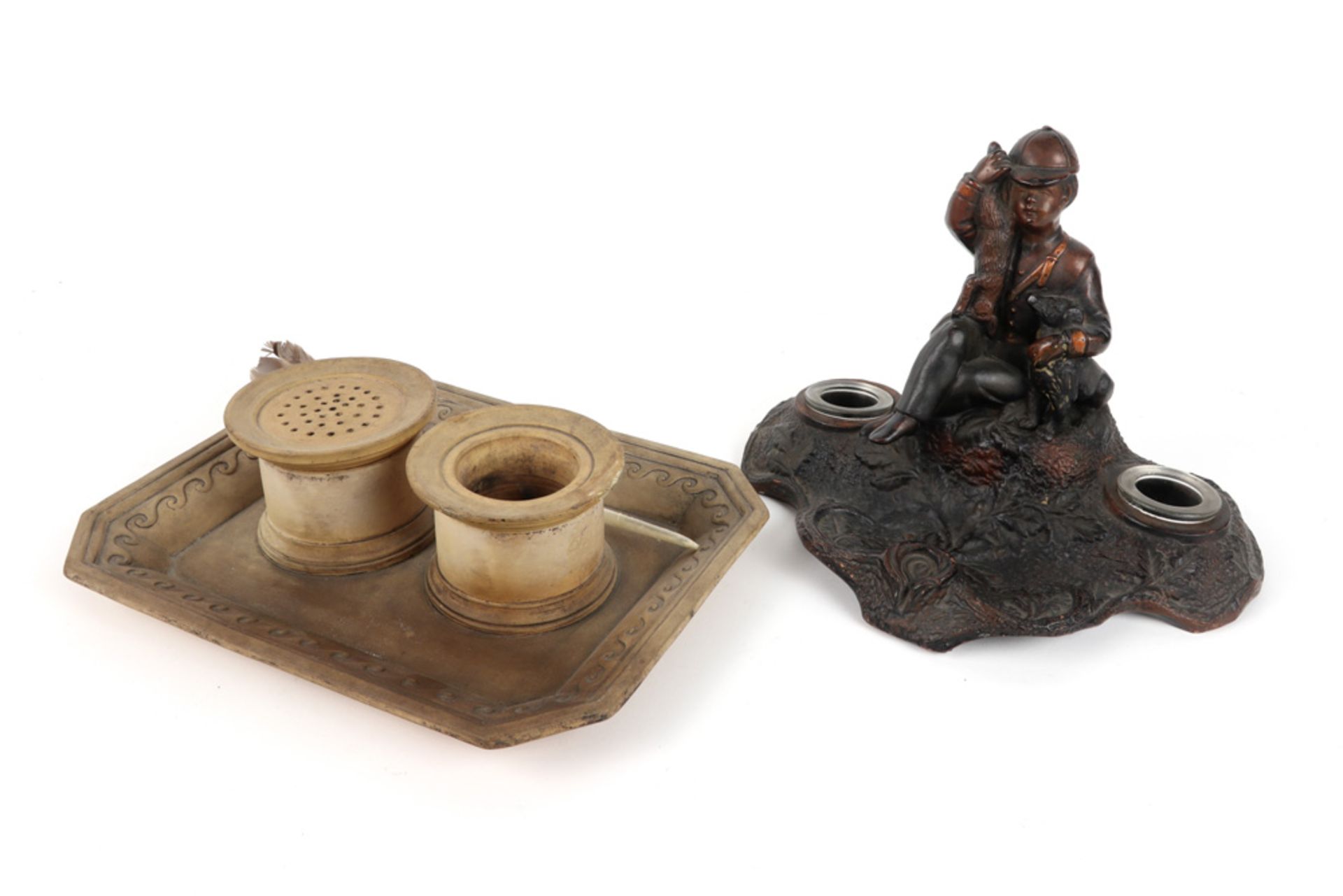 two antique ceramic inkstands, one probably English (with two wells) and one with a boy