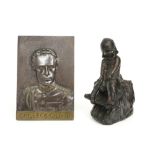 a bronze bas relief with the portrait of King Leopold III and a galvano sculpture