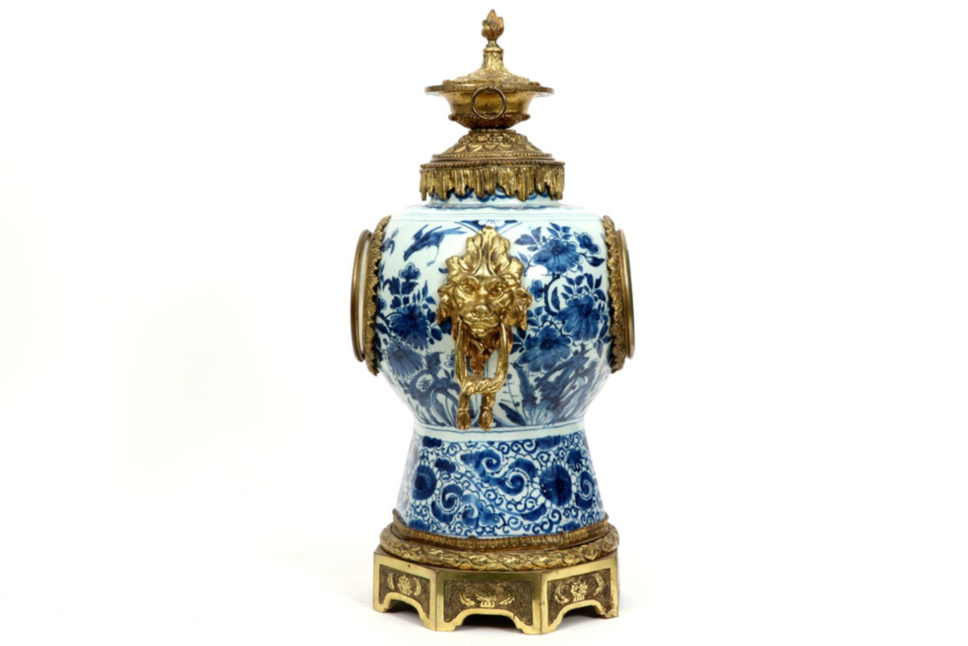19th Cent. clock with an 18th Cent. Delft ceramic vase with blue-white decor and with mountings in g - Image 2 of 3
