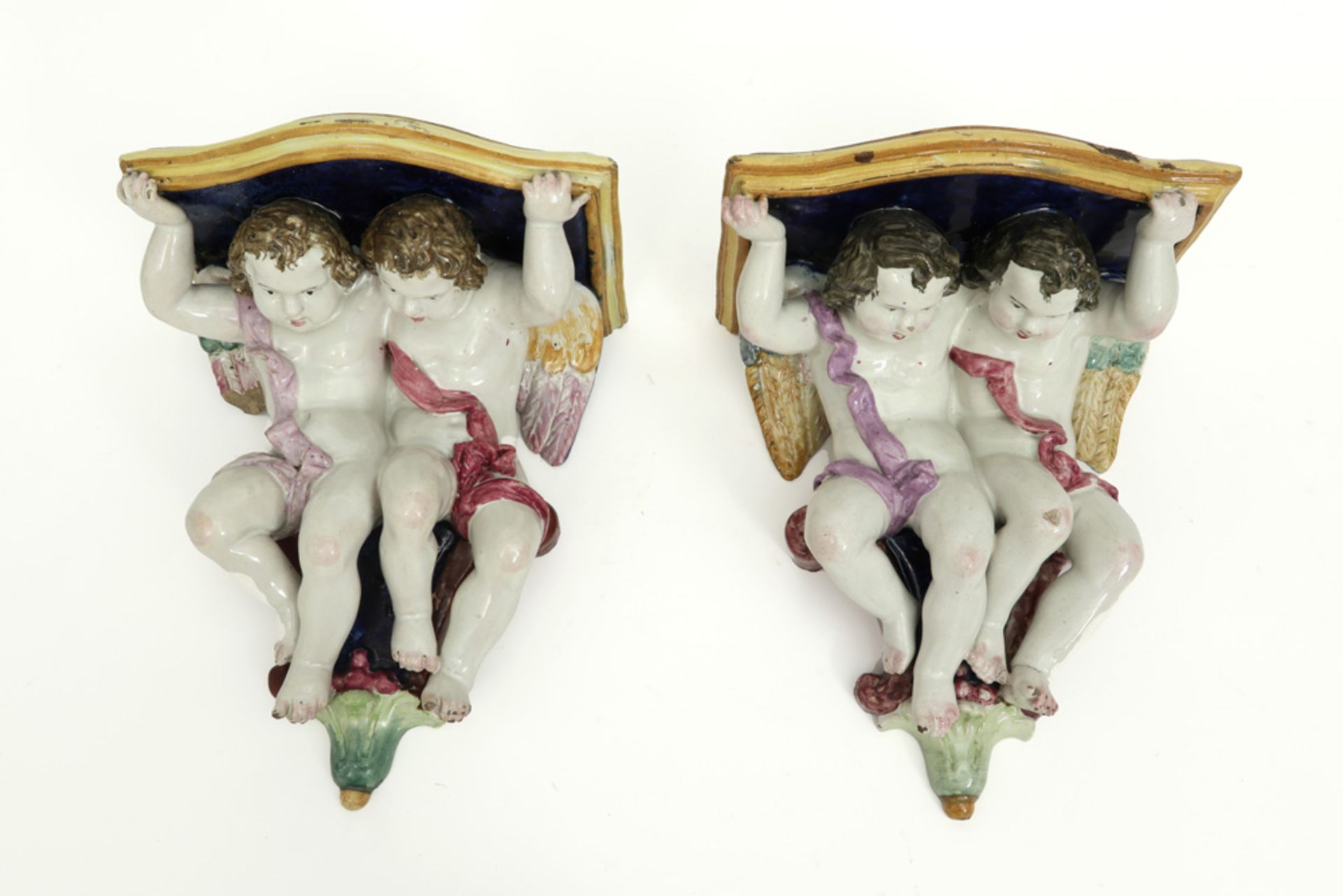 pair of Italian wall hanging consoles, each with two cupids, in polychromed ceramic  - Image 2 of 4