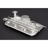 English bureauset with inkwell, small candlestick, pens, ... on a dish in marked silver sold with an