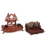 two inkstands in wood, one with inkwells in glass and one with bakelite ones