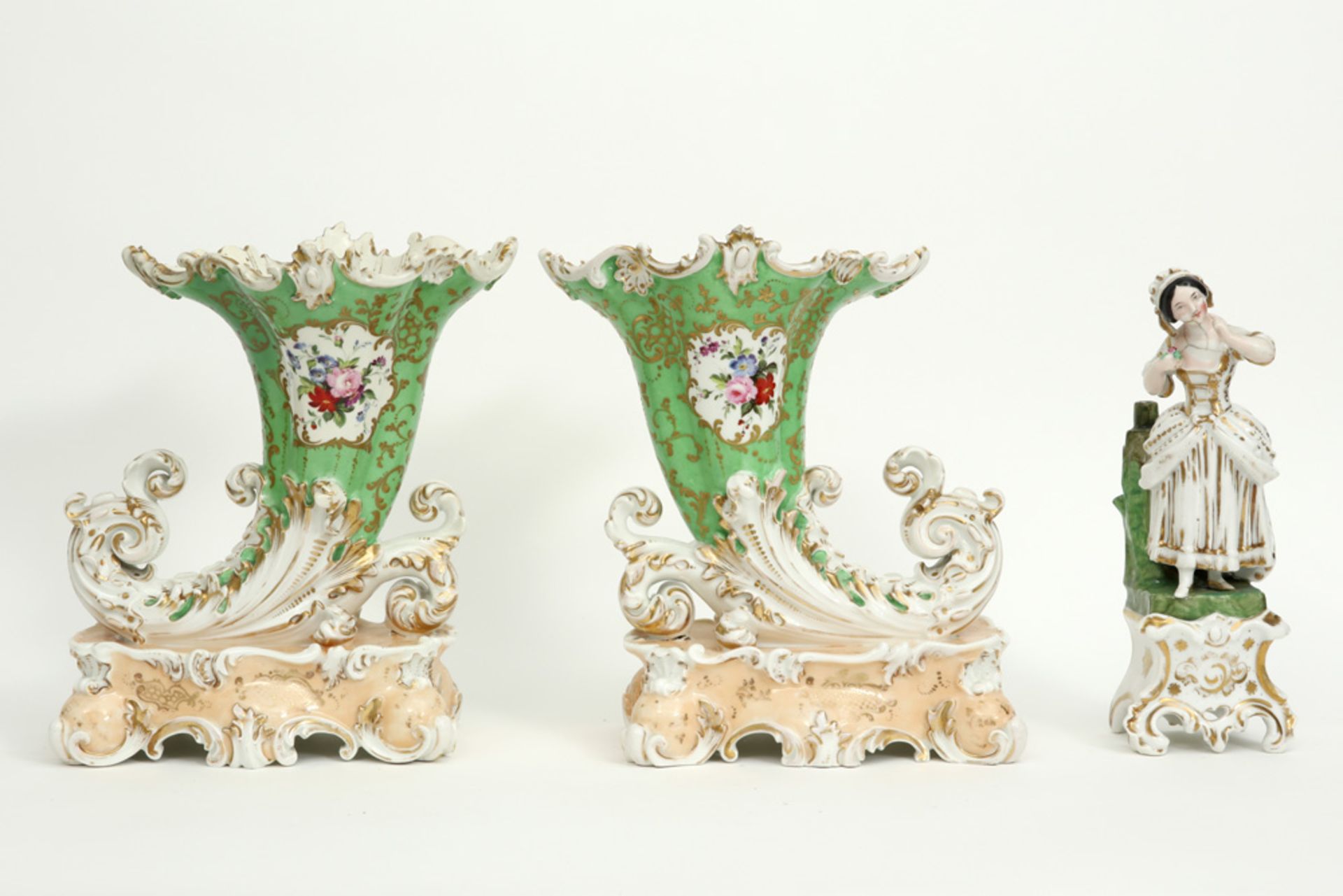 three pieces of antique French porcelain from Paris : a figure and a pair of vases