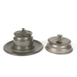 two antique pewter inkstands with a round base - one with three inkwells