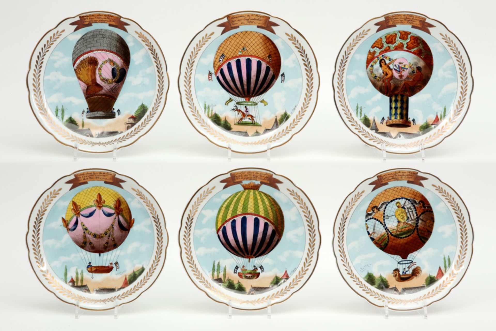 series of six plates in marked porcelain, each with a different polychrome decor with an air balloon