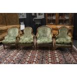 set of four neoclassical walnut armchairs with sculpted Louis XVI style ornamentation