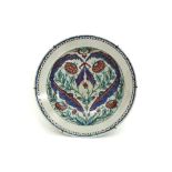 quite big antique dish in porcelain with a polychrome Iznik floral decor
