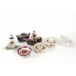 seven antique and old inkstands in porcelain, one with a figure standing in a boat