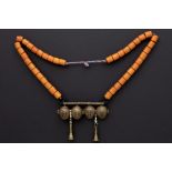 North Indian Naga necklace with beads and a wooden pendant with four bronze heads