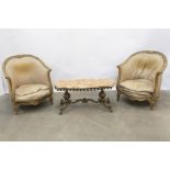 pair of Louis XV style armchairs in gilded wood and a fancy table