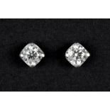 pair of earrings with a nice design in platinum with 1,42 carat (two big ones) and ca 0,15 carat (sm