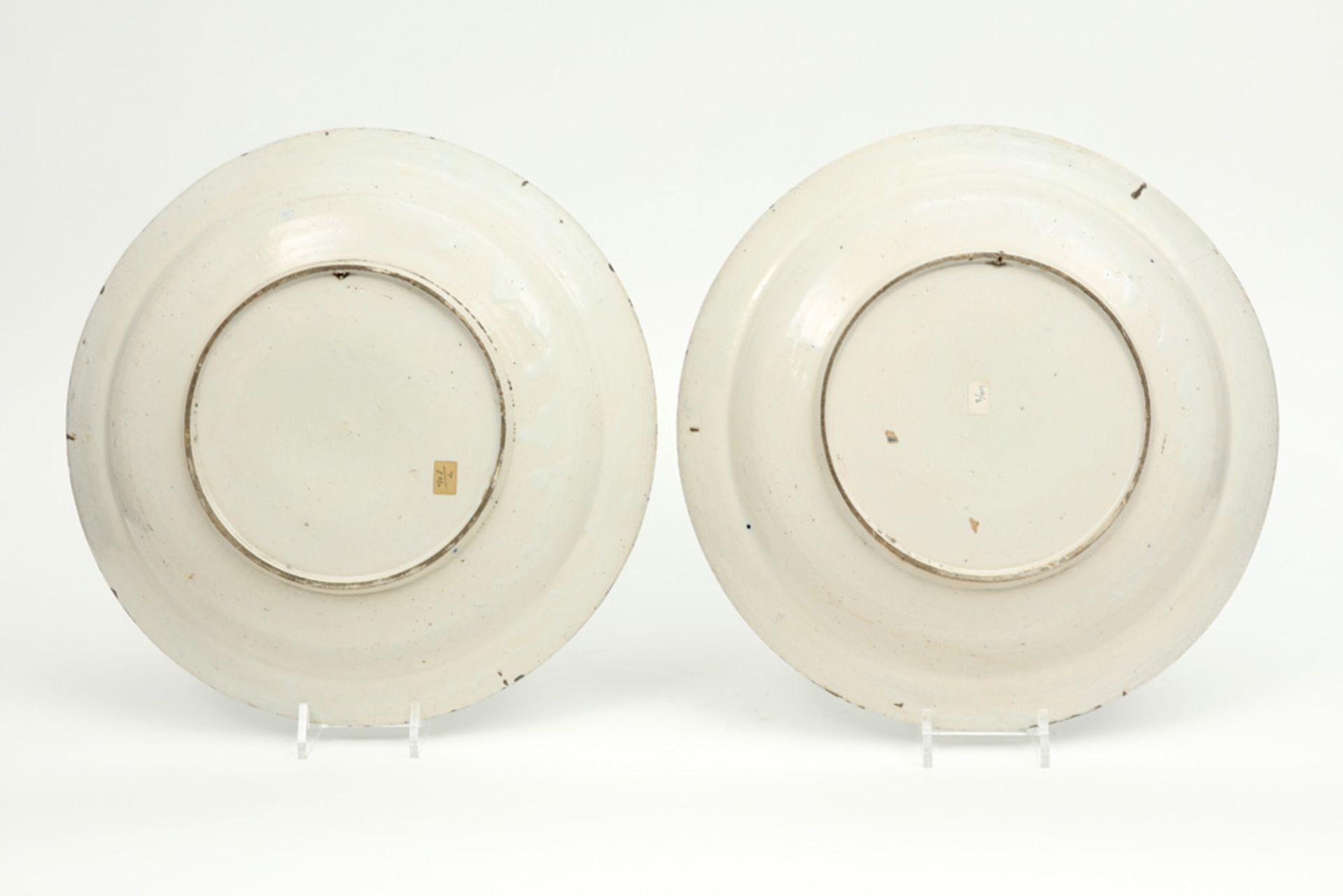 pair of 18th Cent., presumably French, dishes in ceramic with a blue-white decor with flower basket - Image 2 of 2