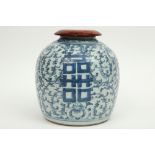 antique Chinese ginger jar in porcelain with a blue-white decor and a wooden lid
