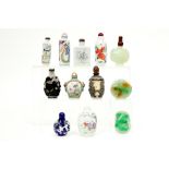 eleven Chinese opium bottles and a Chinese stone pendant