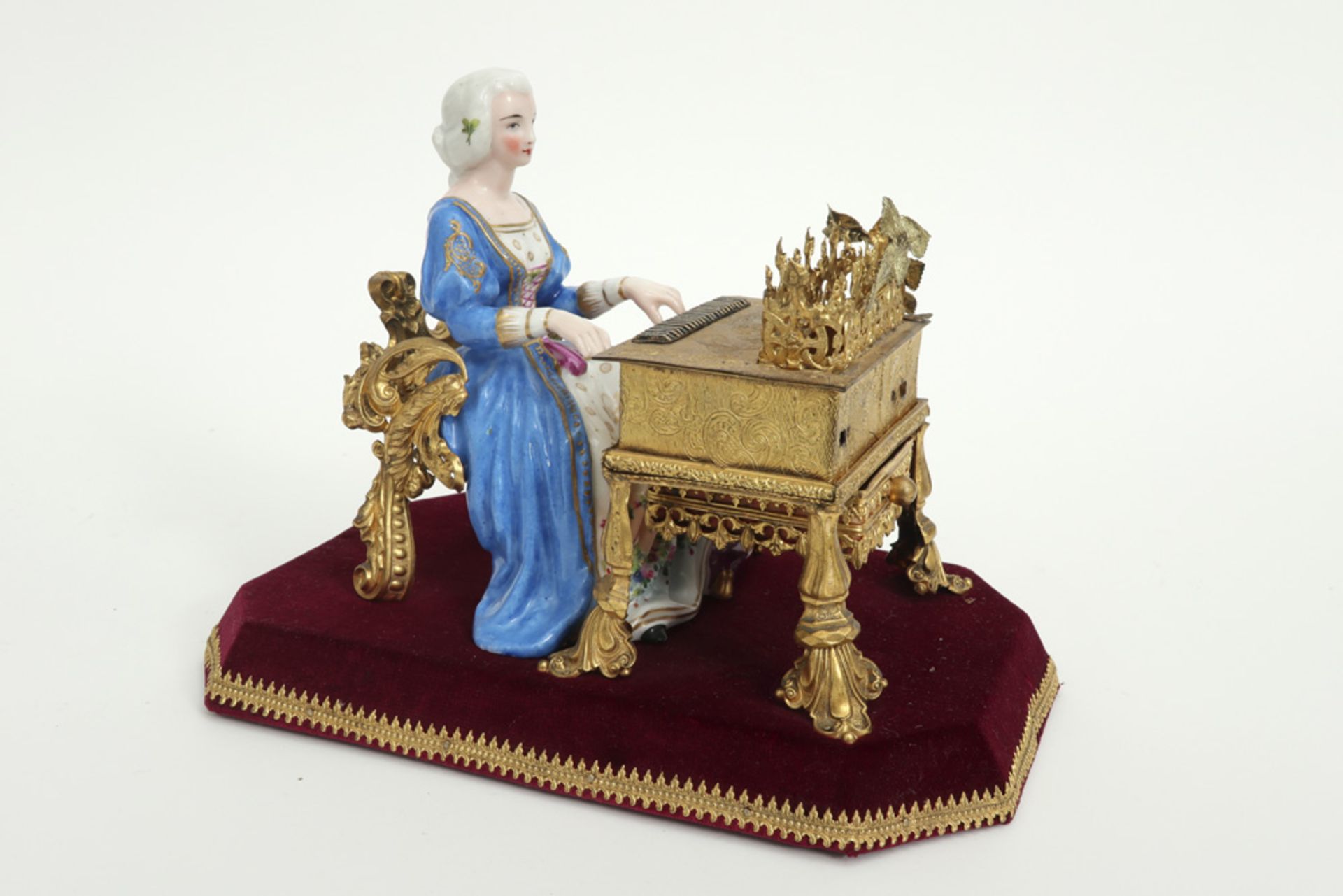quite special figure in porcelain and gilded metal