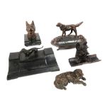 five antique inkstands (one in wood, the others in metal or bronze) each with a horse (head)