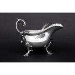 set of an antique English sauce boat and its spoon in marked silver