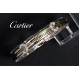 Cartier marked bracelet in white and yellow gold (18 carat) with ca 0,20 carat of high quality brill