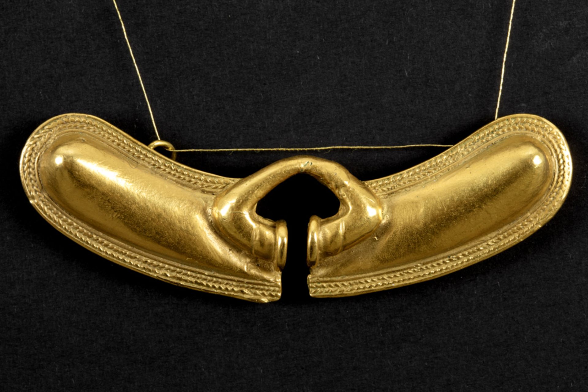 antique and original Pre-Columbian yellow gold naringuera (nose ring)