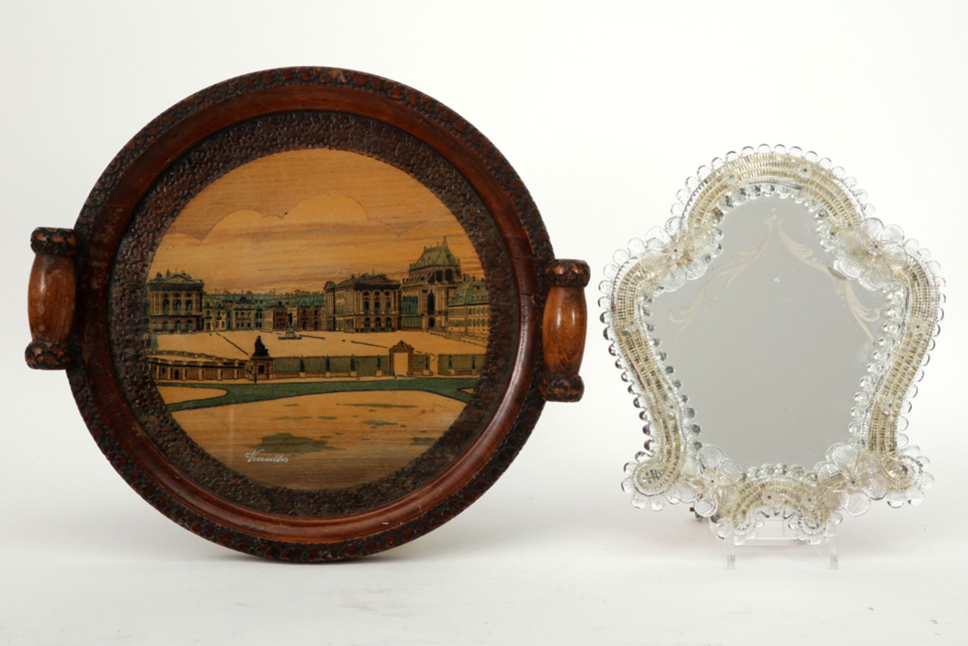 lot with a mirror with Murano glass frame and a round wooden tray with a depiction of Versailles, si