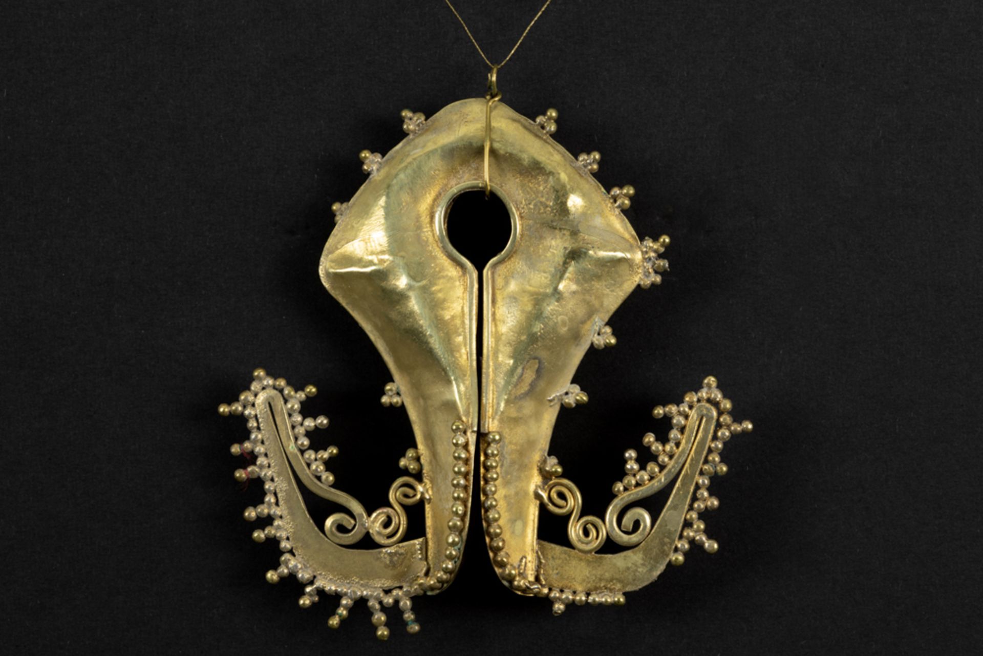 antique Indonesian East Sumba "mamuli" in yellow gold 