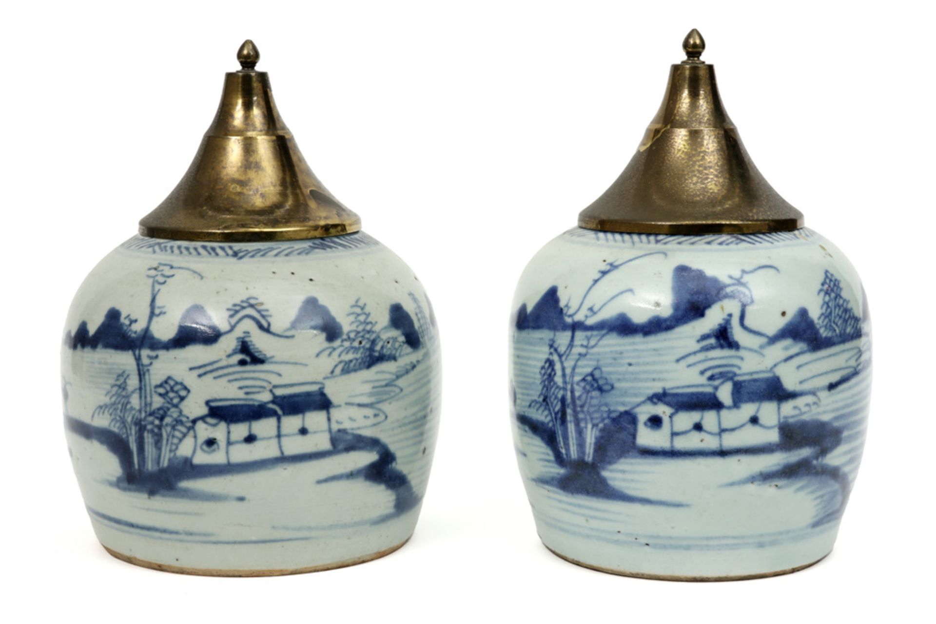 pair of antique Chinese jars in porcelain with a blue-white decor - each with an antique brass lid