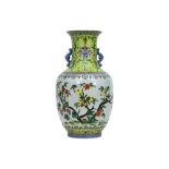 Chinese vase in marked porcelain with a beautiful and refined polychrome decor with a bush with blos