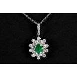 refined pendant in white gold (18 carat) with a ca 0,70 carat Colombian emerald with a nice color, s