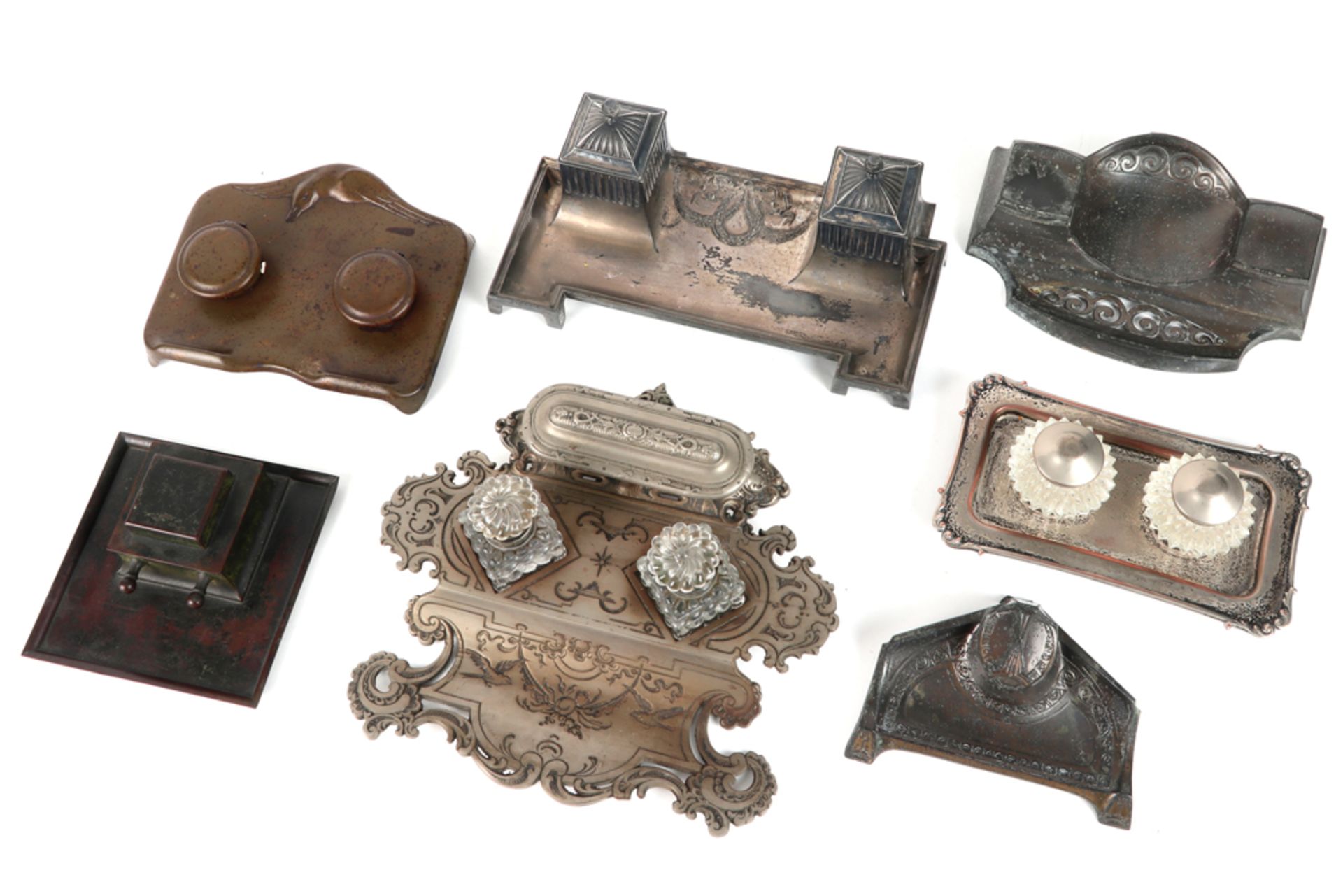 seven antique and old inkstands with a metal mounting