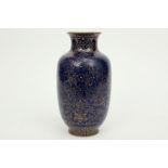 Chinese vase in marked porcelain with a powder-blue glaze with gold floral ornamentation