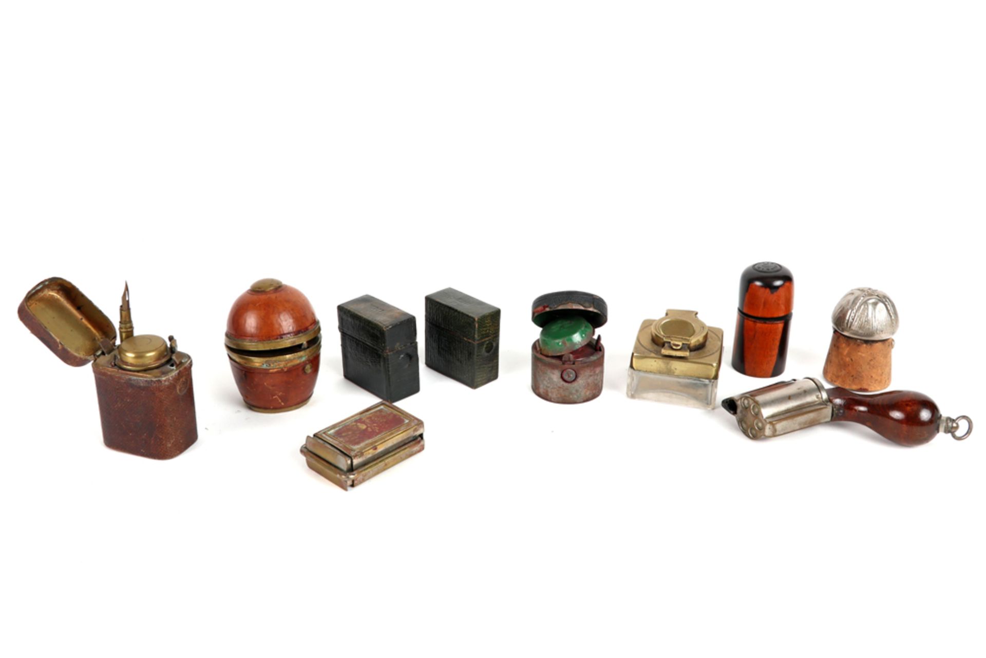 various lot with ten small (travel) inkwells, amogst which one shaped as a pistol and one as a champ