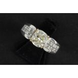 a 1,76 carat light fancy yellow quality cushion cut diamond set in yellow gold (18 carat) on a ring