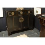 antique Chinese Qing period cabinet in black lacquered wood with typical mountings