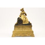 early 19th Cent. French clock in gilded bronze with a "Sitting lady" sculpture - with a work with