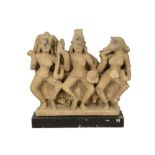 antique Indian stone sculpture representing three deities amongst which Varaha (with pig's head),