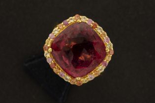 beautiful handmade (unique) ring in yellow gold (18 carat) with a ca 12,50 carat rubelite (cushion