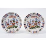 pair of antique pancake plates in ceramic from Delft, marked APK, with a polychrome flowers