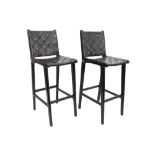 pair of Olivier De Schrijver signed "Kivu" design bar stools in black leather and ebonised mahogany,