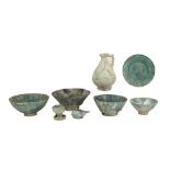 eight archaeological finds in earthenware with iridescent surface : two oillamps, a pitcher, four