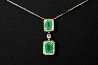 nice vintage pendant in yellow and white gold (18 carat) with two Columbian emeralds and ca 0,40