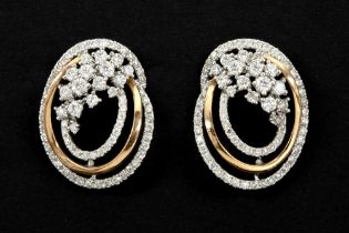 pair of earrings with a very elegant design in yellow and white gold (18 carat) and with ca 1,80